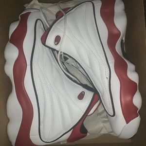 White, red, and black Jordan pro strong